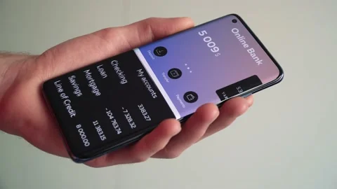 Checking bank accounts balance using the banking app on a smartphone 库存影片 151894184