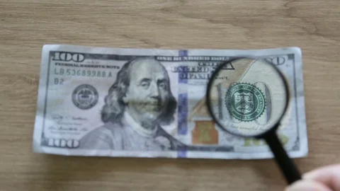 Checking a bank note Vídeo Stock 77091871
