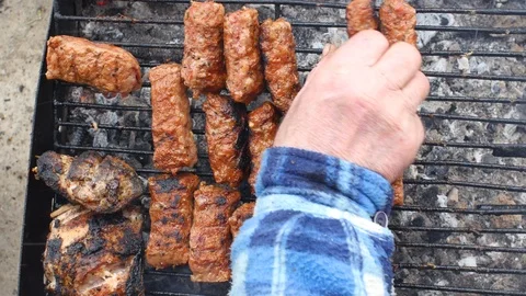 Checking The BBQ On The Grill Stock Footage 87699711