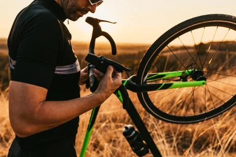 Checking bicycle before ride Stock Photos