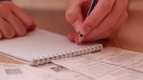 Checking bills and counting costs Stock Footage 83534326