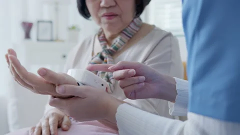 Checking blood pressure at home. Elderly care. 스톡 동영상 152563973