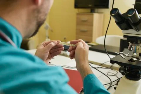 Checking body temperature with a thermometer Stock Photos
