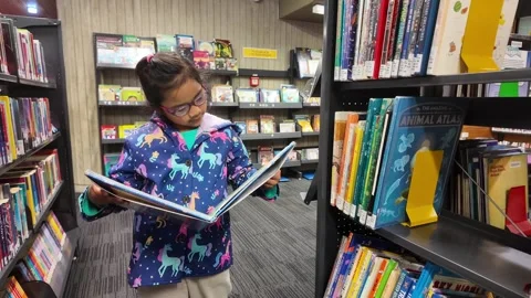 Checking a Book Stock Footage 327614412