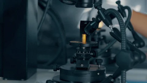 Checking bullet with microscope，criminal investigation，break a case Stock Footage 125461842