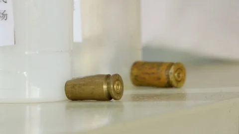 Checking bullet with microscope，criminal investigation，break a case Stock Footage 125461877