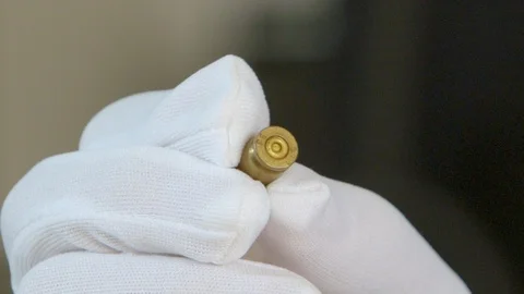 Checking bullet with microscope，criminal investigation，break a case Stock Footage 125461905