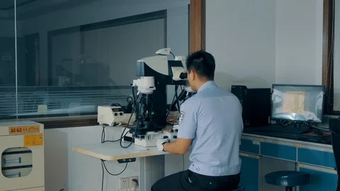 Checking bullet with microscope，criminal investigation，break a case Video stock 125461965