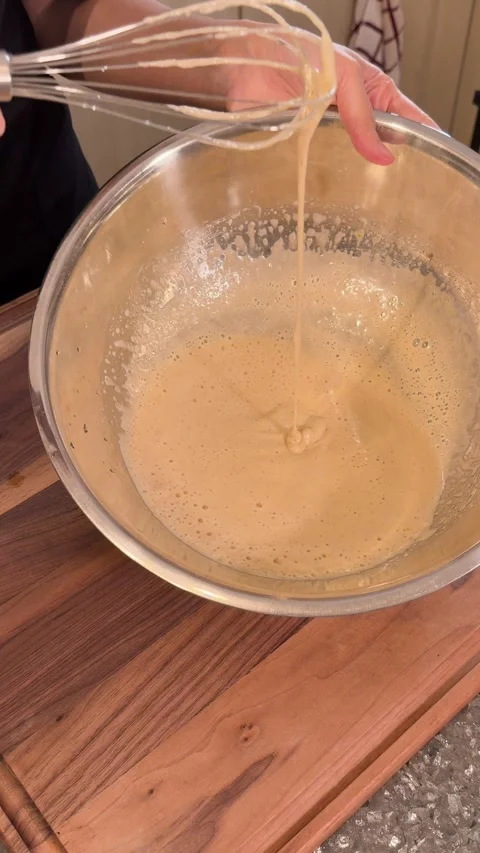 Checking Cake Batter Consistency with Balloon Whisk, Perfect Mixing Texture Stock Footage 331035075
