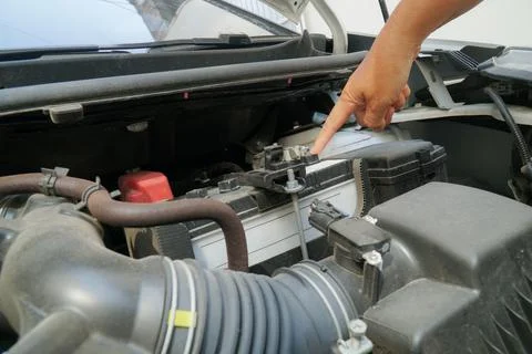 Checking the car battery before a trip Stock Photos