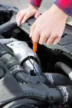 Checking Car Engine Oil Level Under Hood With Dipstick Stock Photos