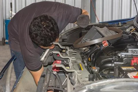 Checking a car at garage Stock Photos