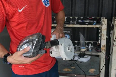 Checking car headlight Foto stock