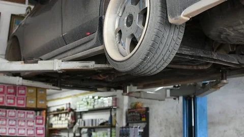 Checking car suspension Stock Footage