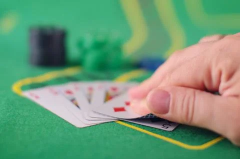 Checking card cheating concept in Poker game Stock Photos