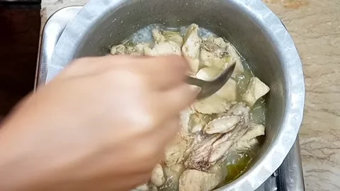 Checking Chicken Tenderness in Boiling Broth, Meal Preparation Close Up Stock Footage 323351984