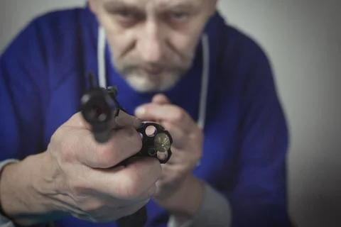 Checking, cleaning and loading of black finished .357 magnum revolver handgun Stock Photos