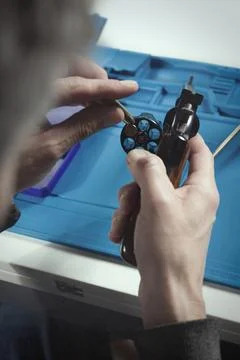 Checking, cleaning and loading of black finished .357 magnum revolver handgun Stock Photos