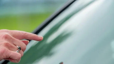 Checking the cleanliness of a car window Stock Footage 78219696