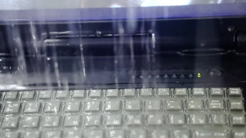 Checking a computer keyboard for water resistance. Stock Footage 206111250