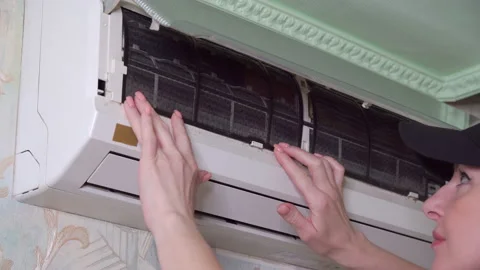 Checking condition of filters in air conditioner in apartment. Stock Footage 197611989