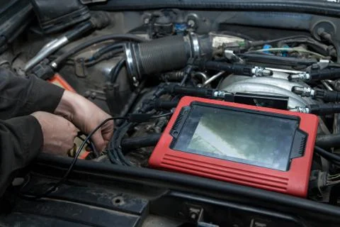 Checking the condition of the surface of the engine cylinders using an endosc Stock Photos