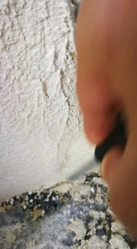 Checking the consistency of the finish of an external wall Video stock 330872388