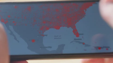 Checking coronavirus epidemic status in tablet at home Video stock 128240717