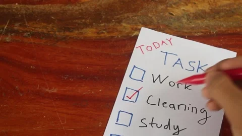Checking Off Daily Tasks on Paper Stockbeeldmateriaal 345712437