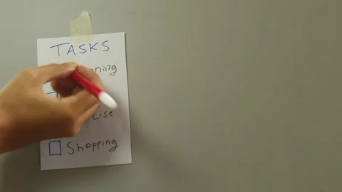Checking Off Daily Tasks on Wall Stockbeeldmateriaal 345712442