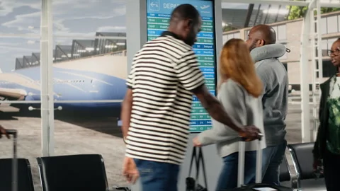 Checking departure board, timetable data and man in airport lounge Stock Footage 333652978