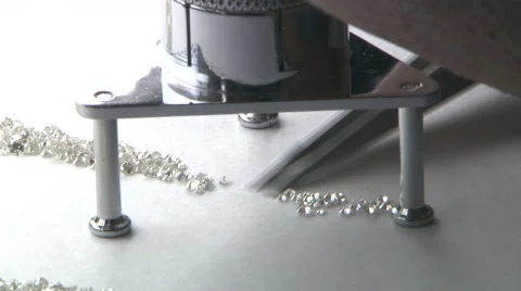 Checking diamonds under a microscope Stock Footage 40061510