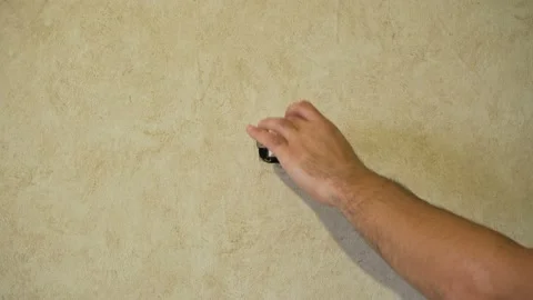 Checking the electrical switch on the wall 4K Stock Footage 101135813