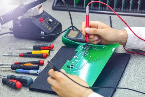 Checking the electronic device. Assembly of electronic boards. Stock Photos