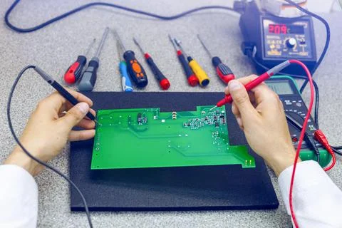 Checking the electronic device. Assembly of electronic boards. Stock Photos