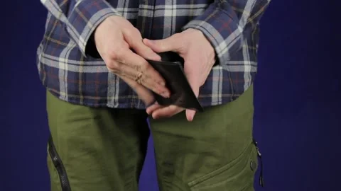 Checking empty wallet close-up. Long shot of casual person looks into the wallet Stock Footage 148132394