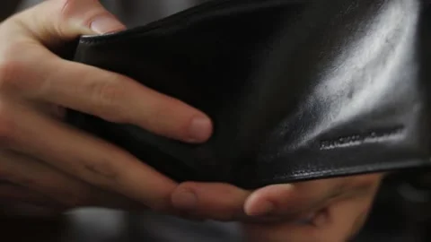 Checking empty wallet close-up. Long shot of casual person looks into the wallet Stock Footage 148188273