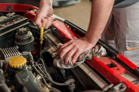 Checking for engine oil on a car Stock Photos
