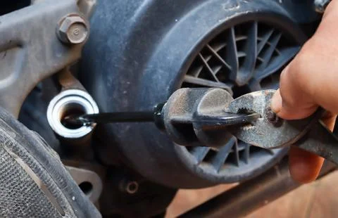 Checking the engine oil level and condition Stock Photos
