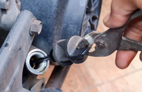 Checking the engine oil level and condition Stock Photos