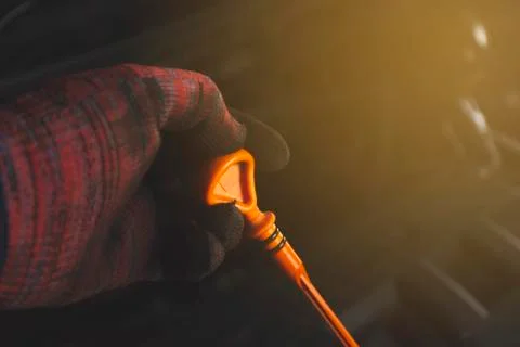 Checking engine oil level. Stock Photos