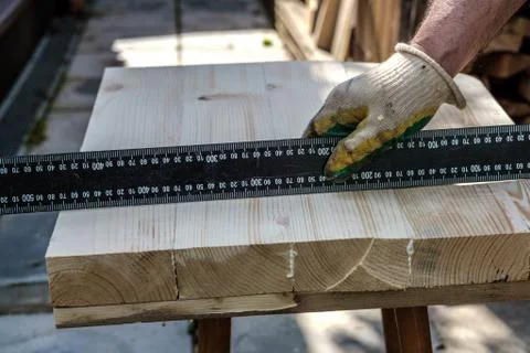 Checking the evenness of the surface of the board. Stock Photos