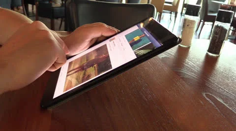 Checking facebook on iPad mini Stock Footage 25786603