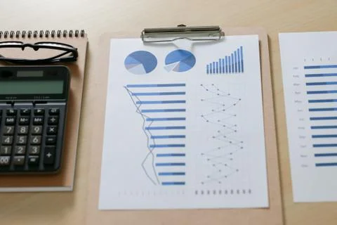 Checking financial reports paperwork and Business  Teamwork on table calculat Stock Photos