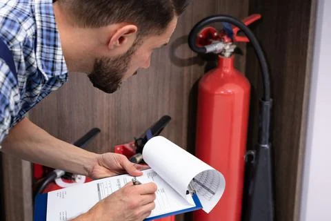 Checking Fire Extinguisher. Safety Stock Photos