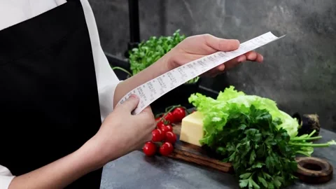 Checking fresh ingredients while preparing a delicious meal at the kitchen Stock Footage 296315808