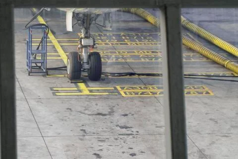Checking the front wheels of the aircraft. Stock Photos