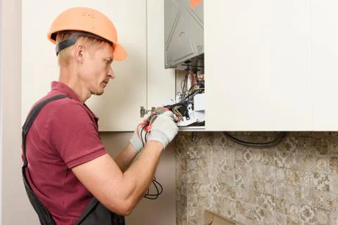 Checking the gas boiler. Stock Photos