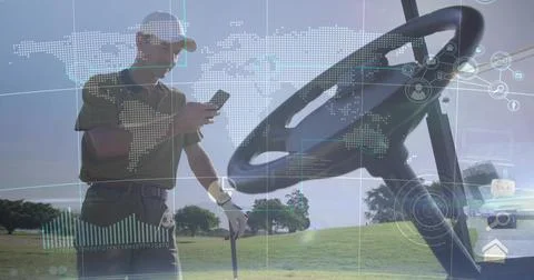 Checking golfer wearing baseball cap and striped polo, holding golf club, phone Stock Photos