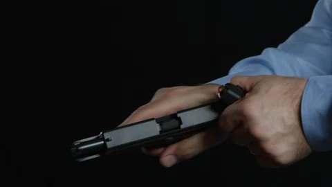 Checking a handgun Stock-Footage 113880644